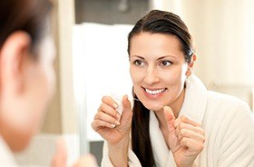 Dental appointment marked on calendar with red push pin