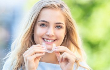 Invisalign aligners in a blue case