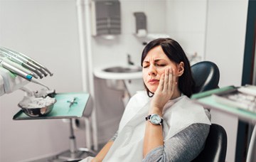 Woman afraid in the dental chair