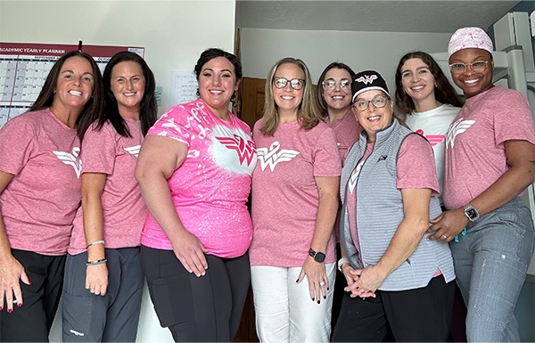 Buzzards Bay dental team members smiling in parking lot